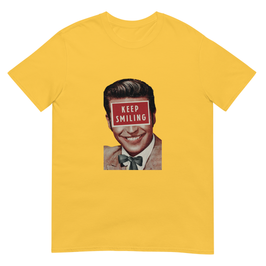 Yellow t-shirt with a graphic of a smiling man with a 'Keep Smiling' sign over his eyes on a white background.